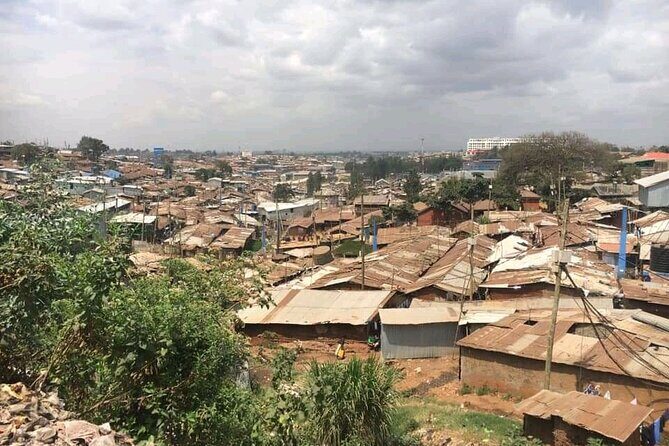 Private Tour in Kibera the Largest Slum - Toi Main Market finish: seeing trade up close